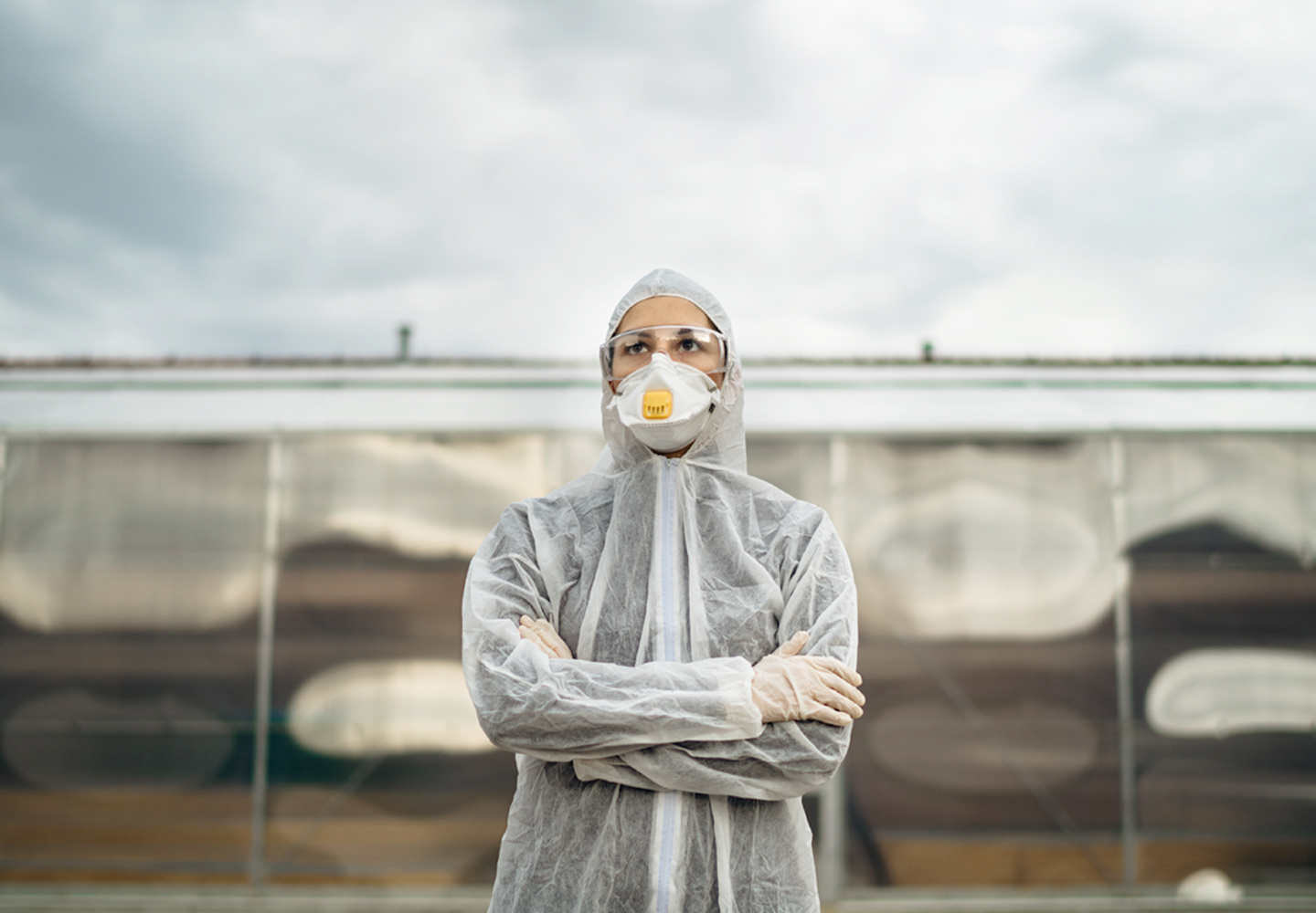 person at farm in personal protective gear