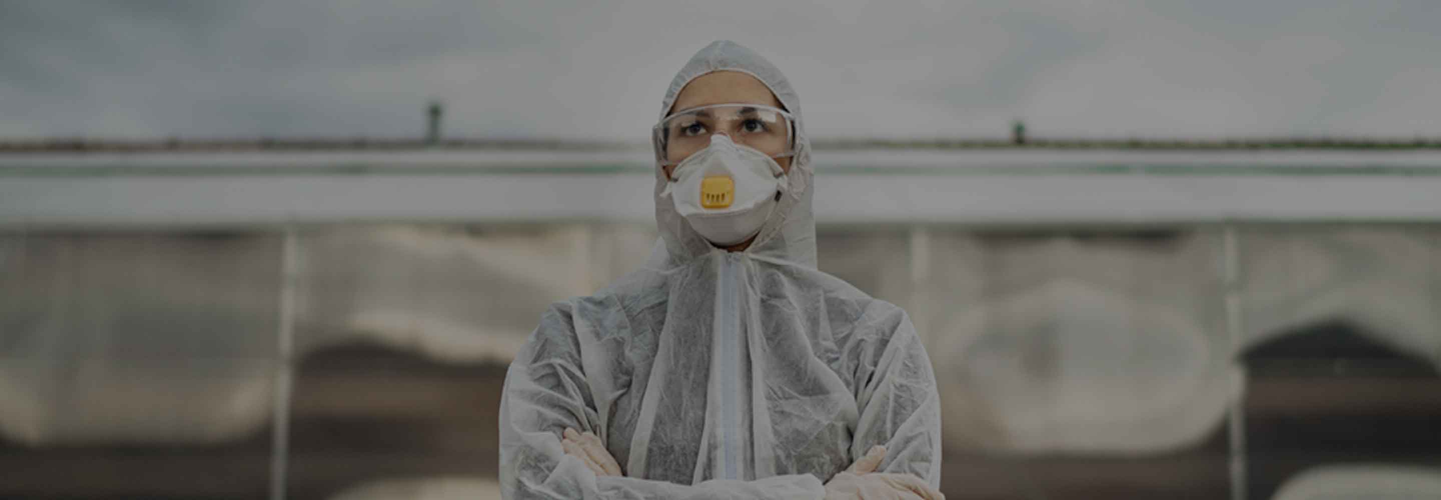 person at farm in personal protective gear