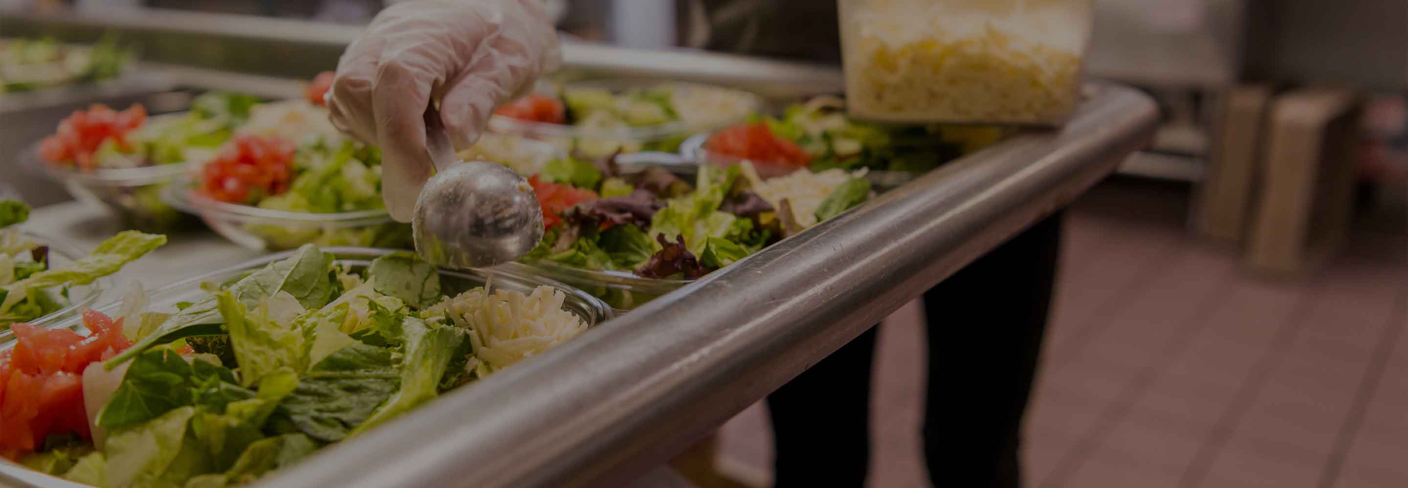 Wendy's crew member prepping salads