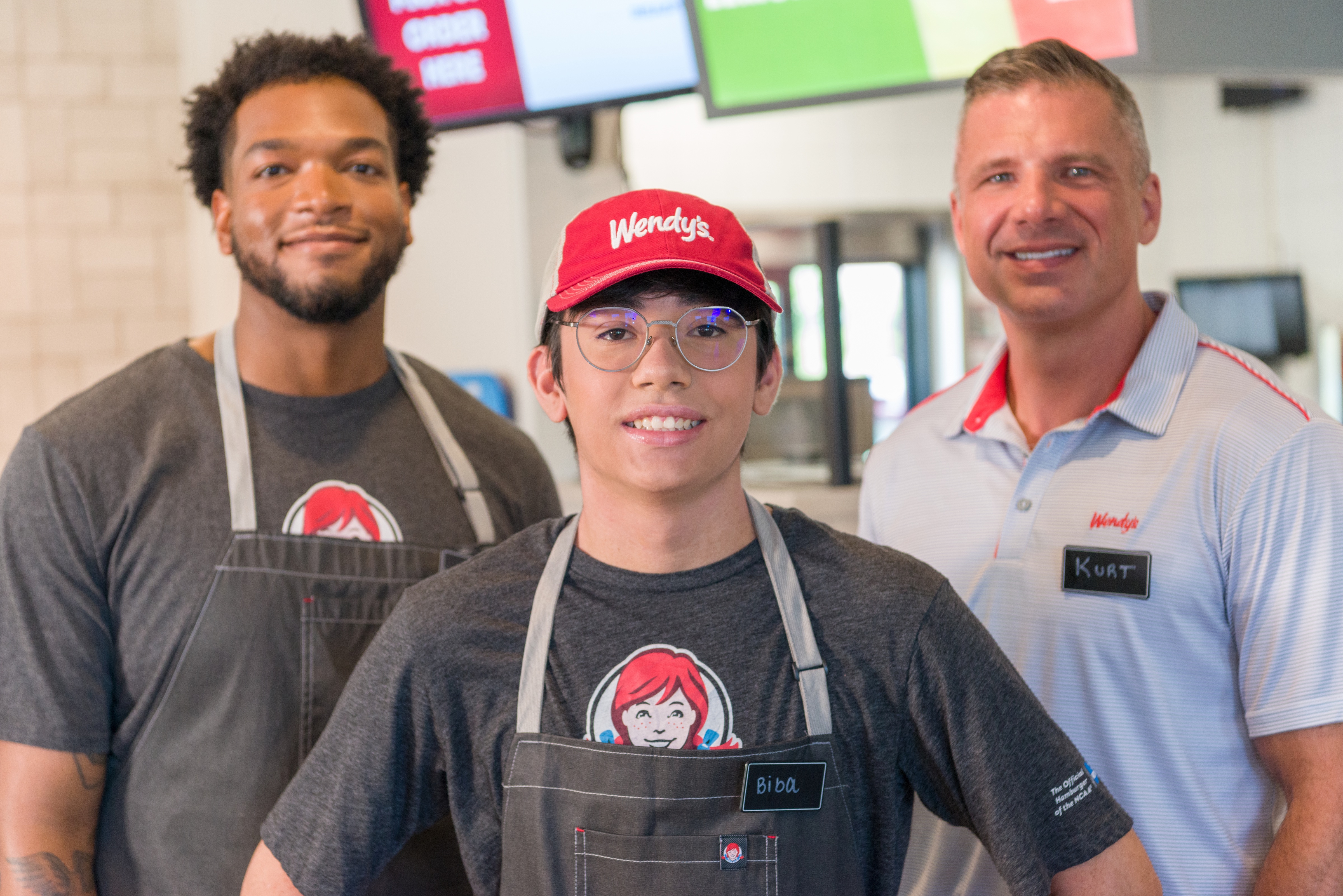 Wendy's team smiling in the store