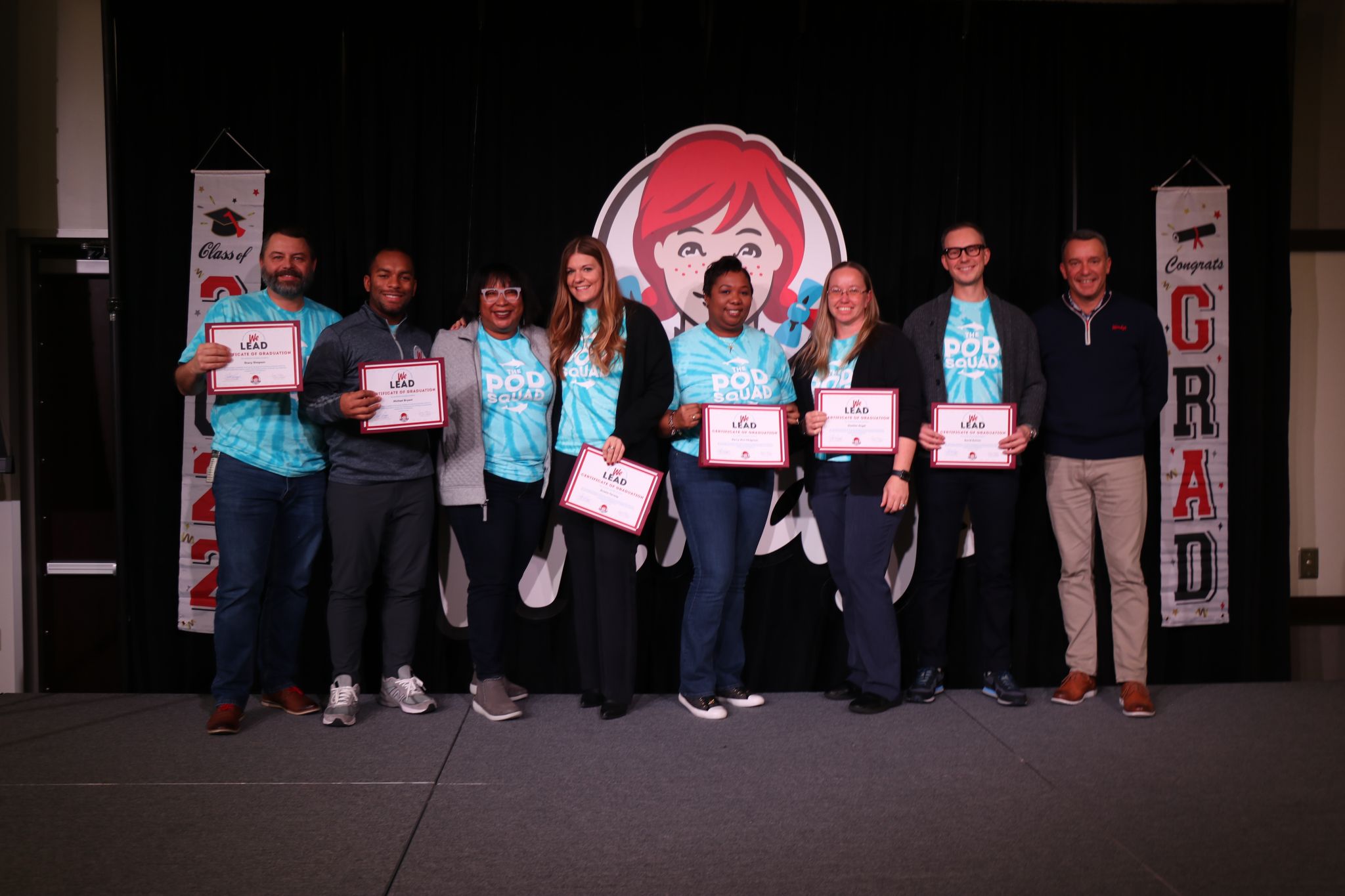 Employees graduating from leadership program