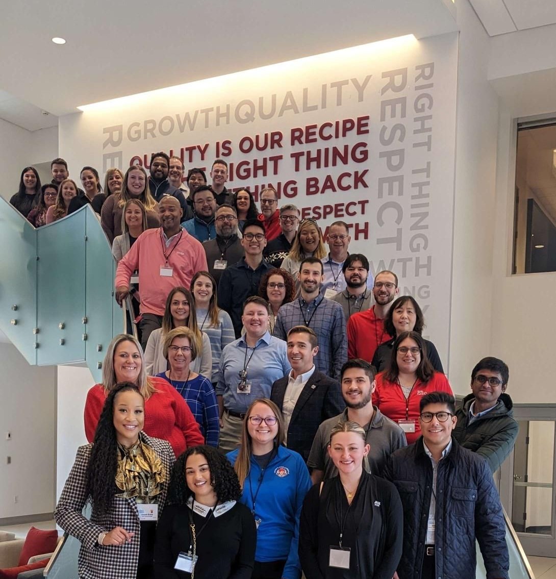 Wendy's employees standing on stairwell at headquarters