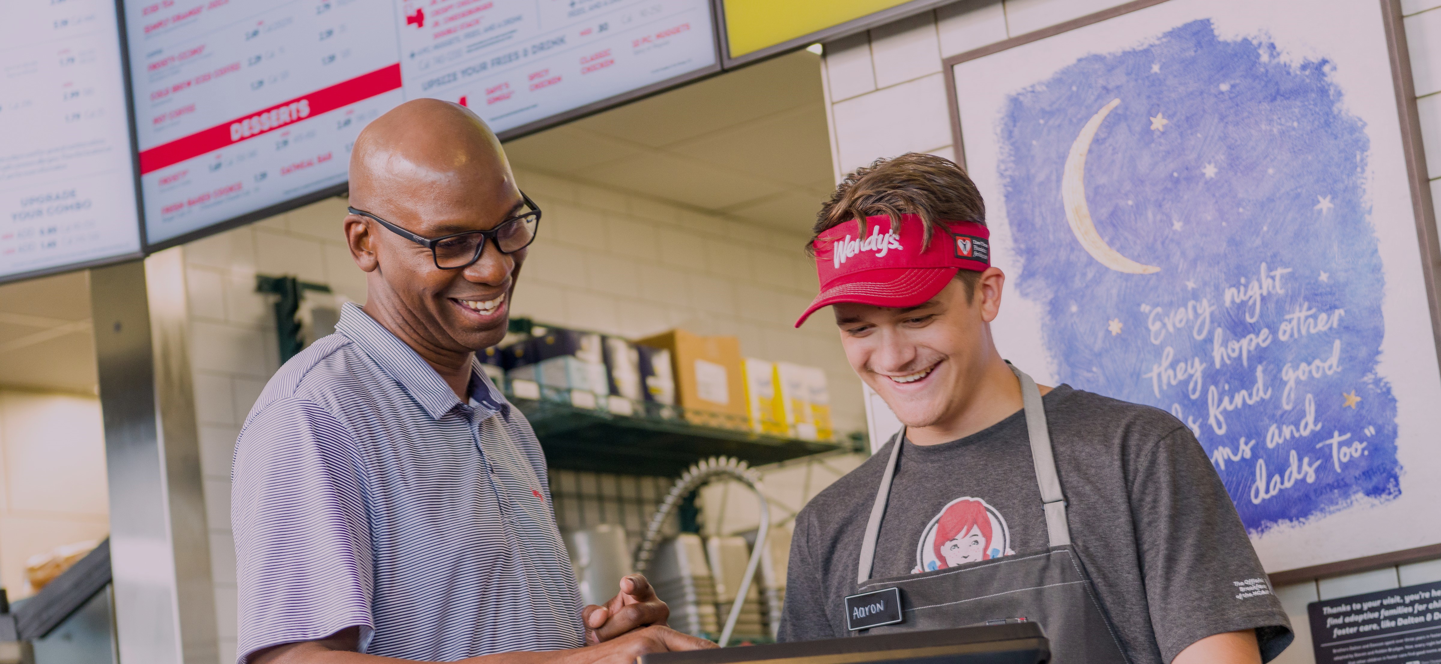 Wendy's team working together at the register.