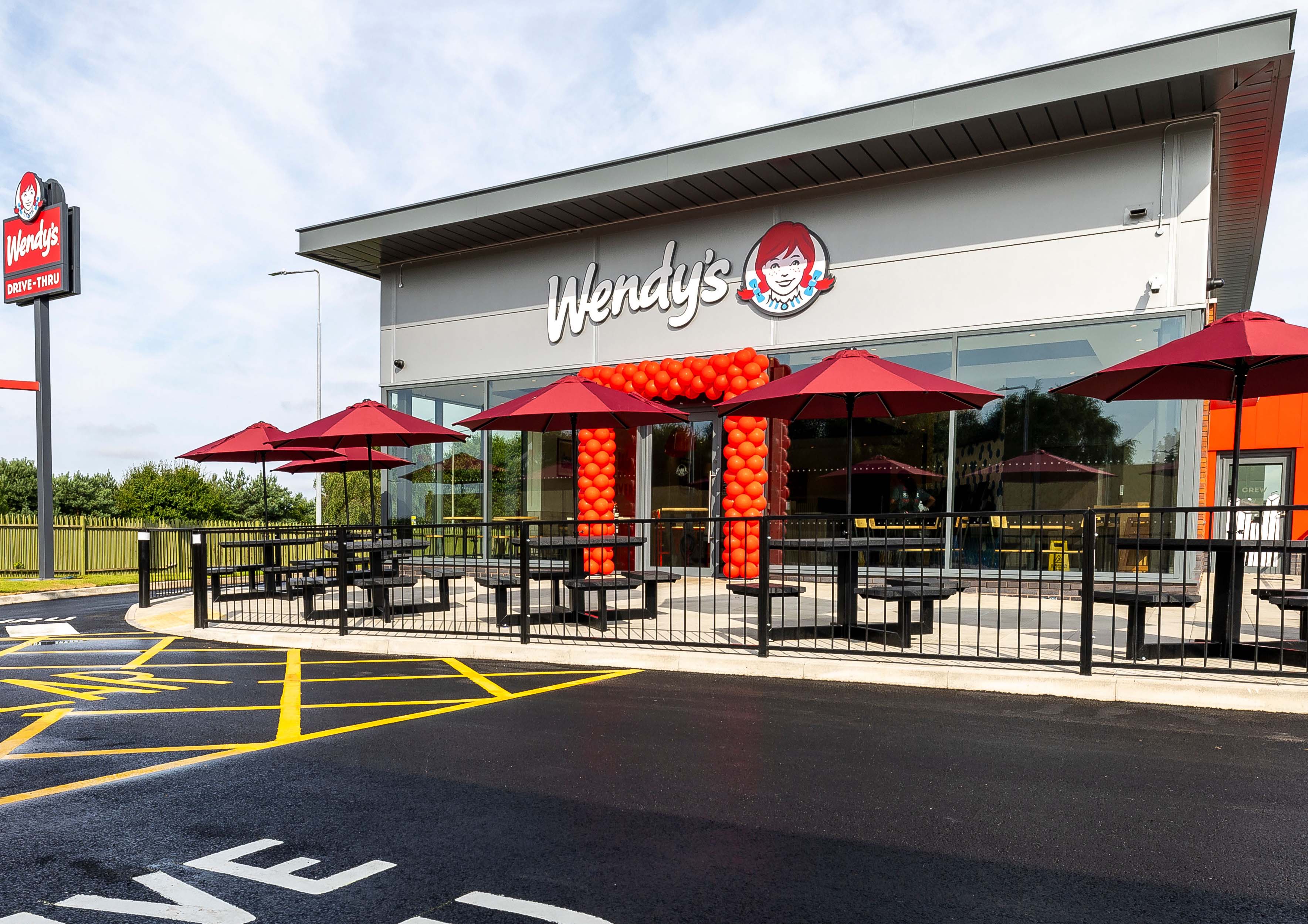 Outside of a Wendy's restaurant and drive-thru in Liverpool, England
