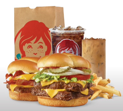 Get Wendy's Delivered: Breakfast Baconator® combo with seasoned potatoes and Frosty-ccino®, and Dave's Double® combo with fries and soft drink next to a Wendy's bag