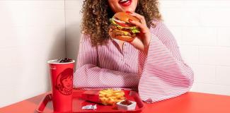 Person eating hamburger