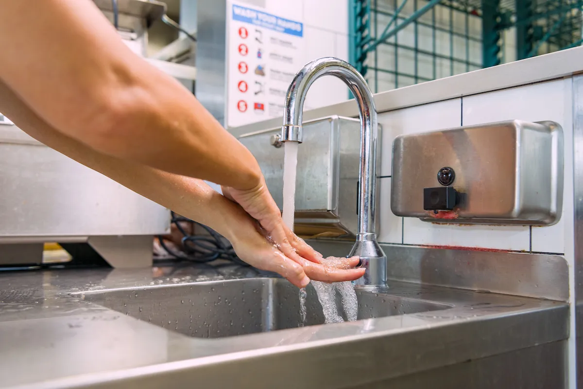 Crew member washing hands